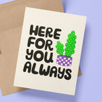 A risograph printed greeting card with kraft envelope, sits on a periwinkle background.